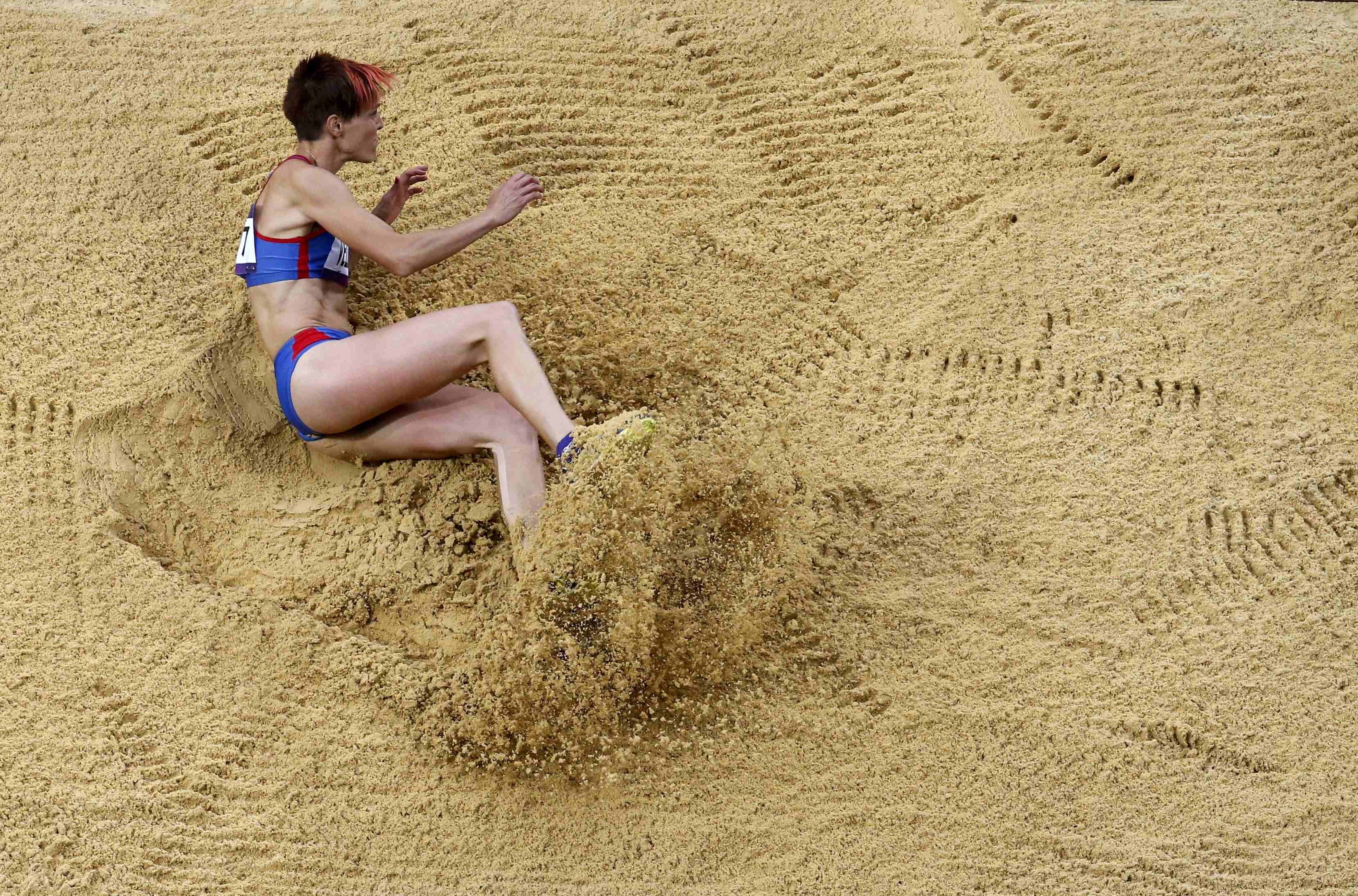 athlete in sand pit