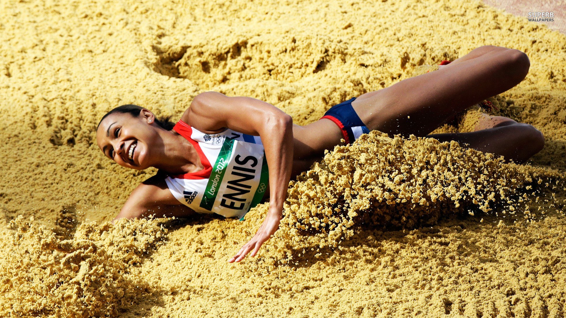 athlete in sand pit