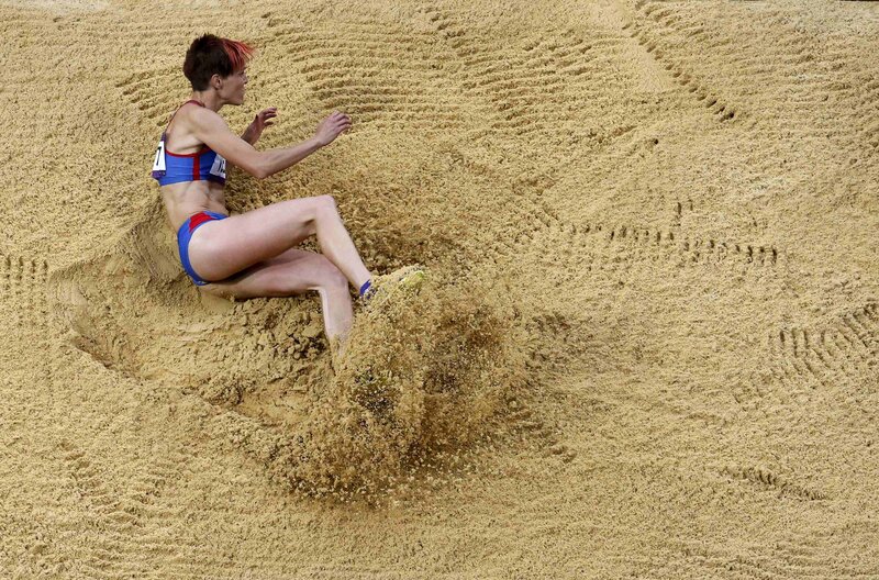 Athlete in Sand Pit — Brown, Dynamic, Photograph