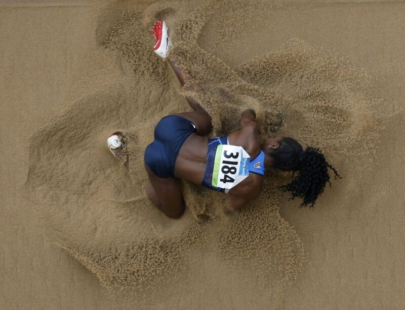 Athlete Landing in Sand