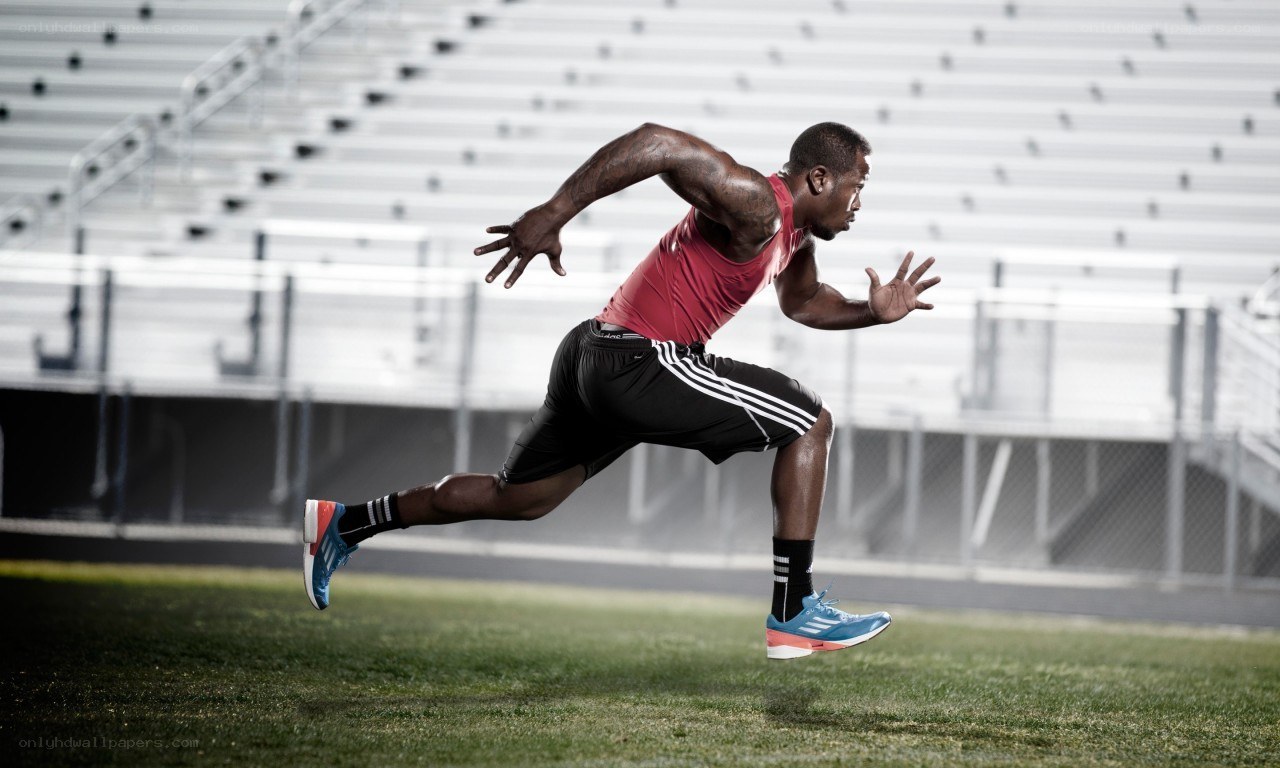 athlete running on field