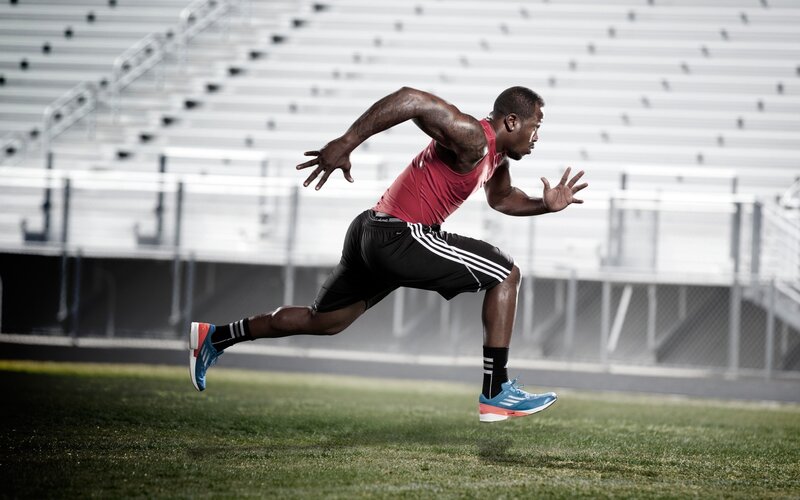 athlete running on field