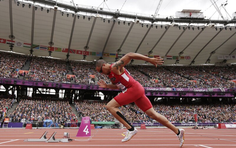 Athlete Running on Track — Red