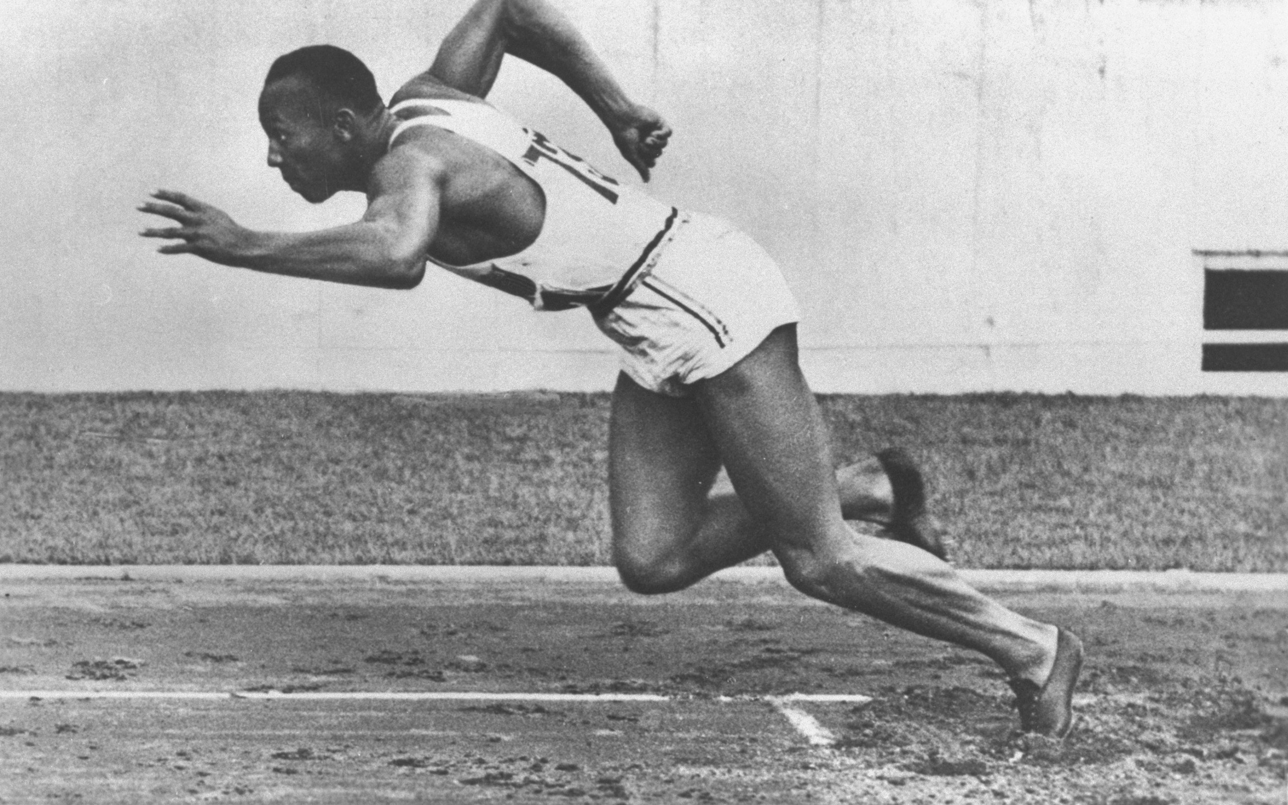 athlete running on track