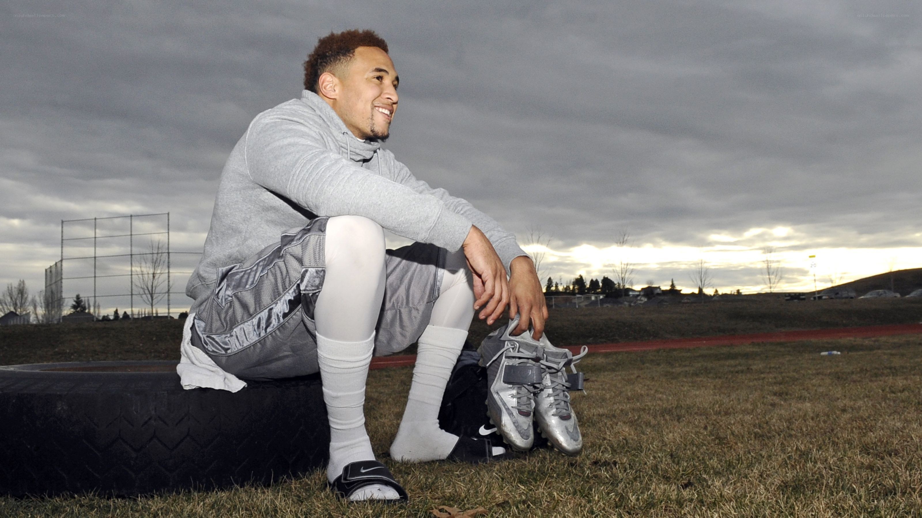 athlete sitting on tire