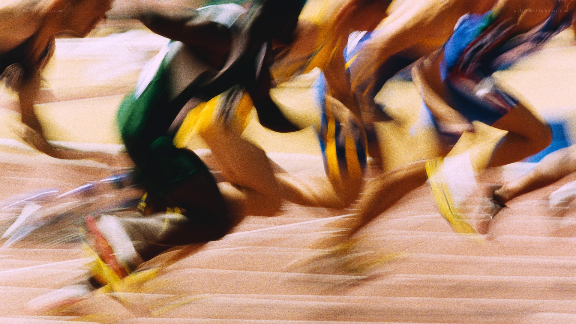 athletes in motion on track