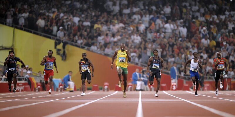 Athletes Running Track — Red