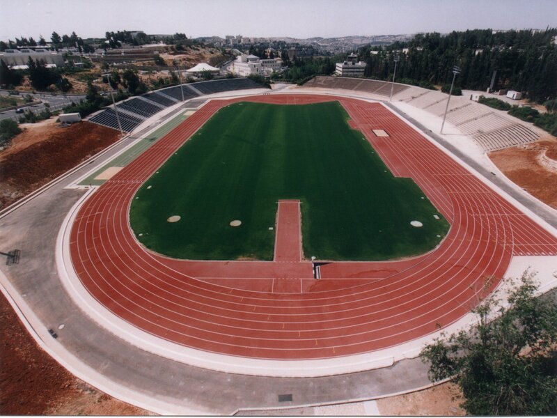 Athletic stadium with running track
