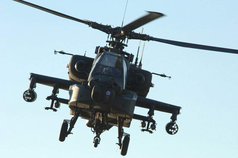 Attack Helicopter in Flight — Gray, Dramatic, Afternoon, Photograph