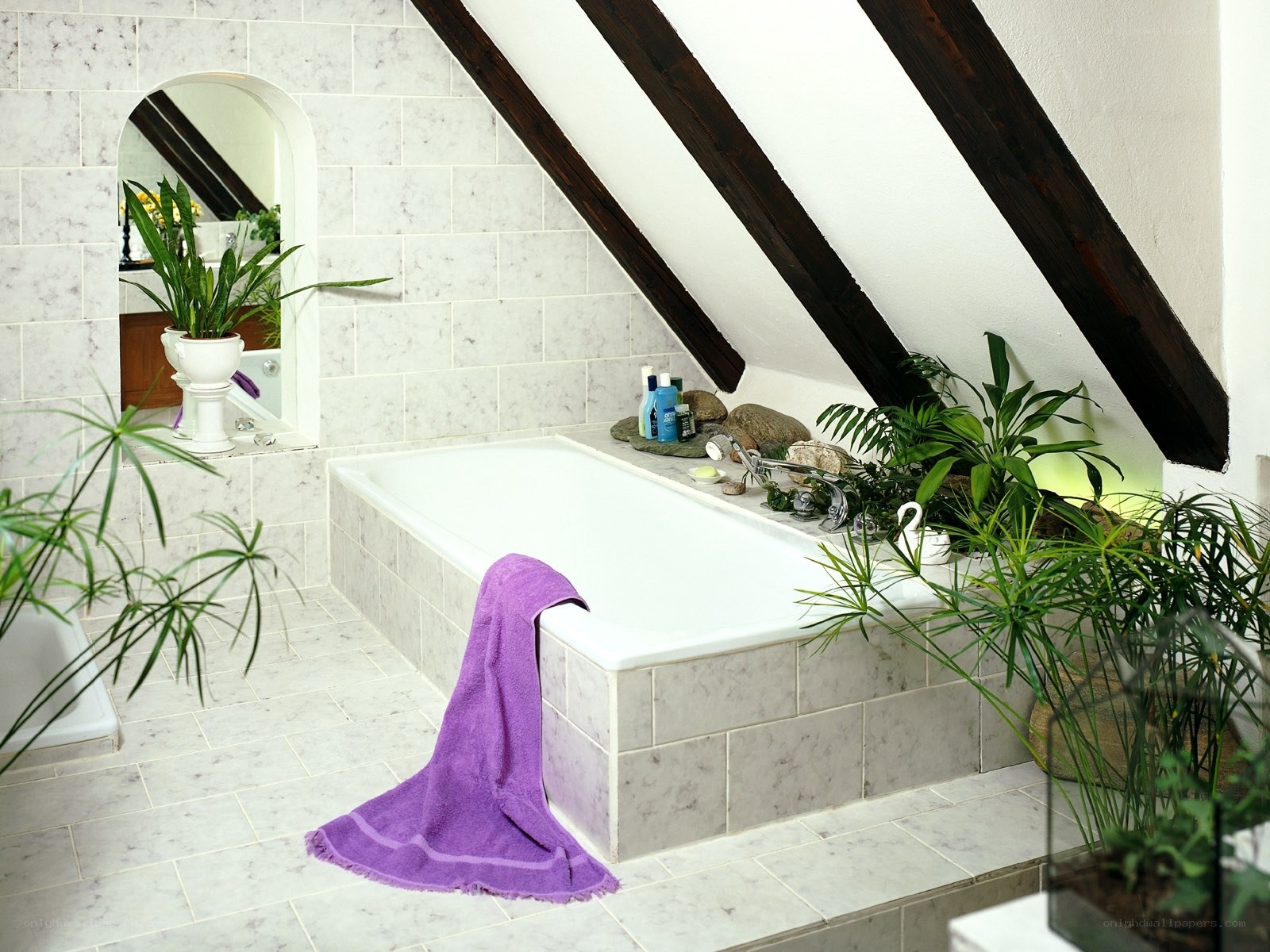 Attic bathroom with bathtub