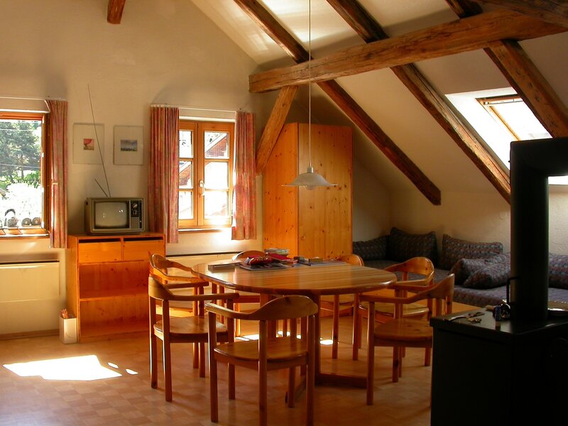 Attic living room with wooden furniture