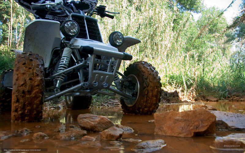 ATV crossing muddy water