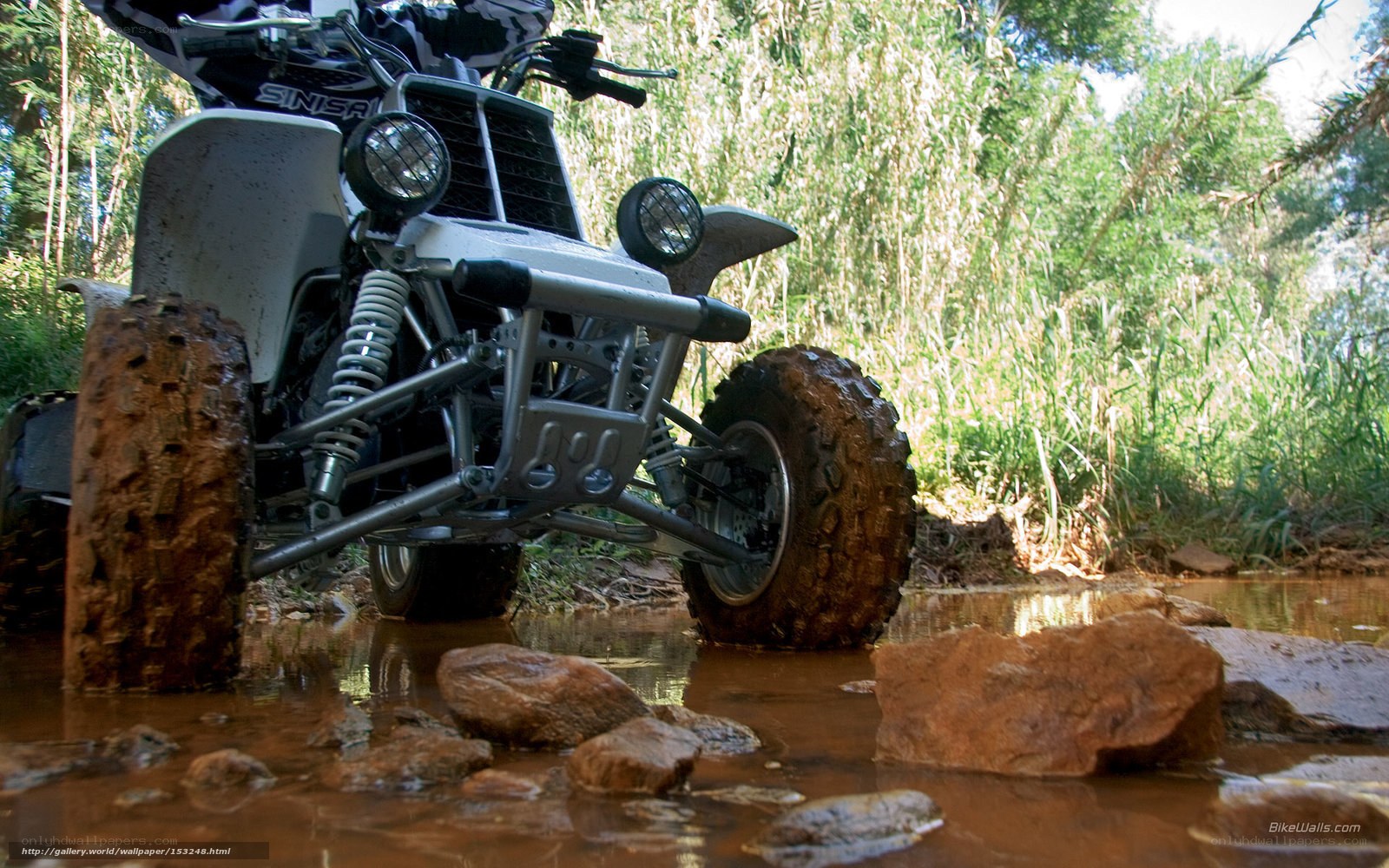 ATV crossing muddy water