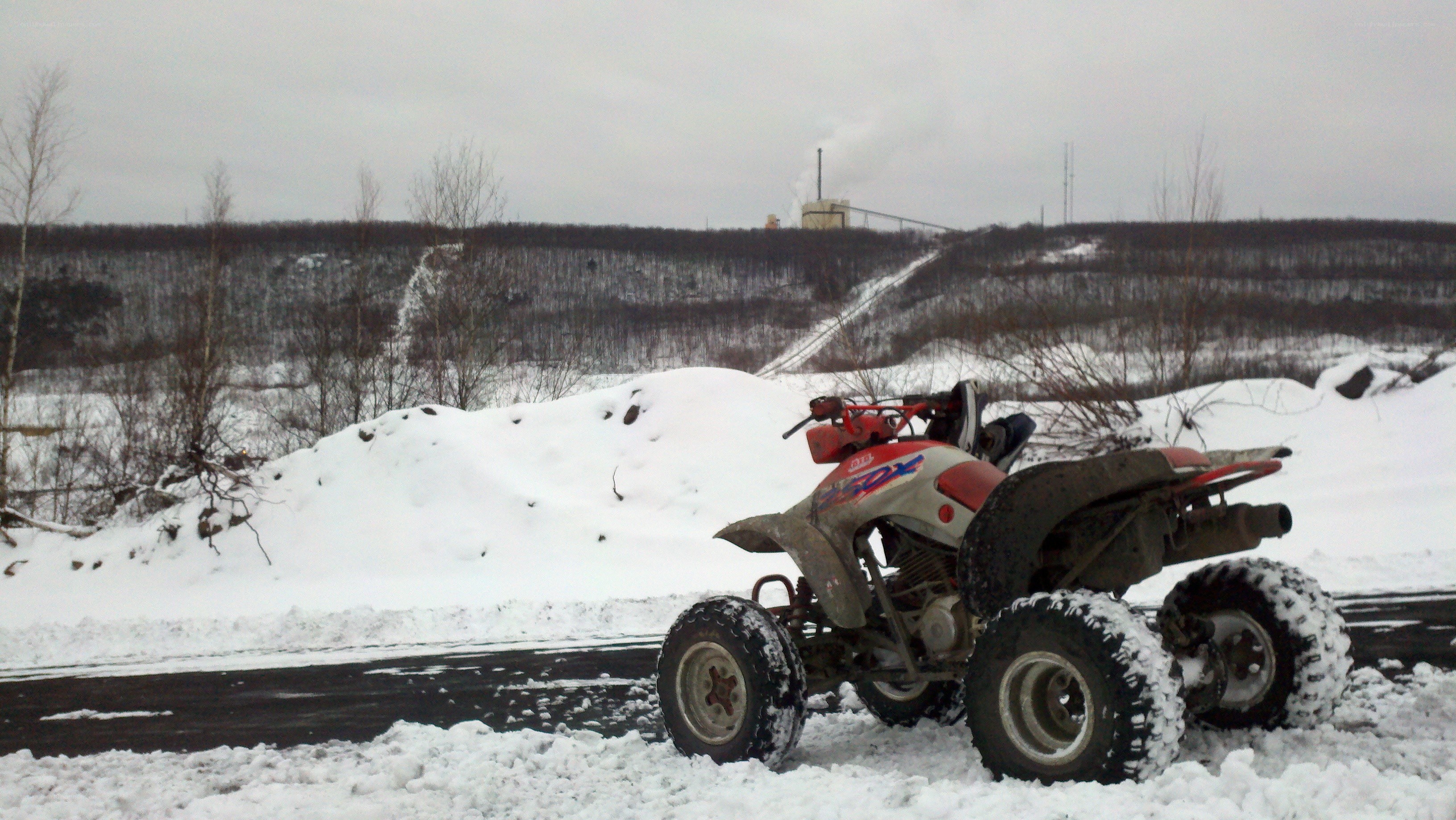 ATV on snowy roadside