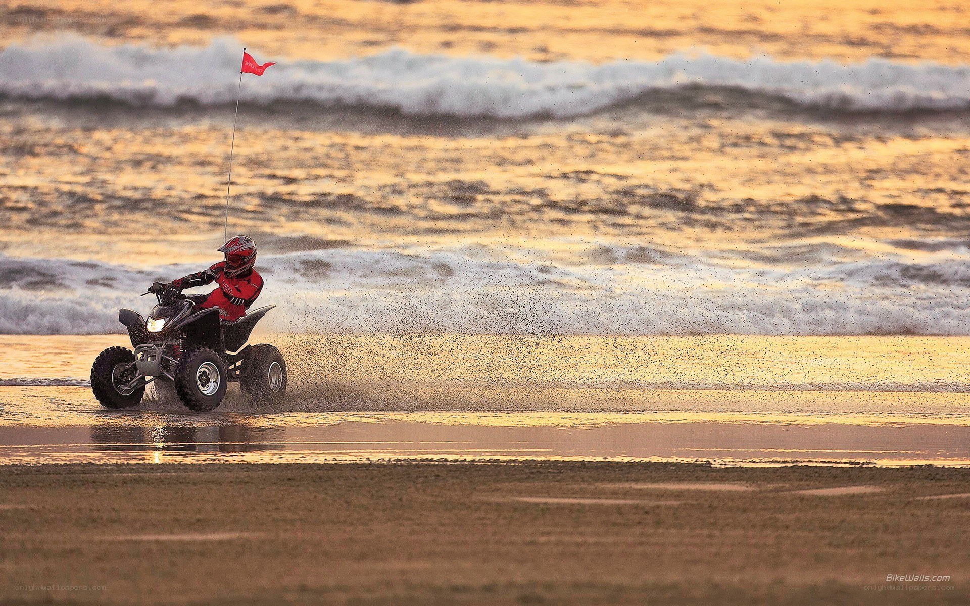 ATV on the beach at sunset