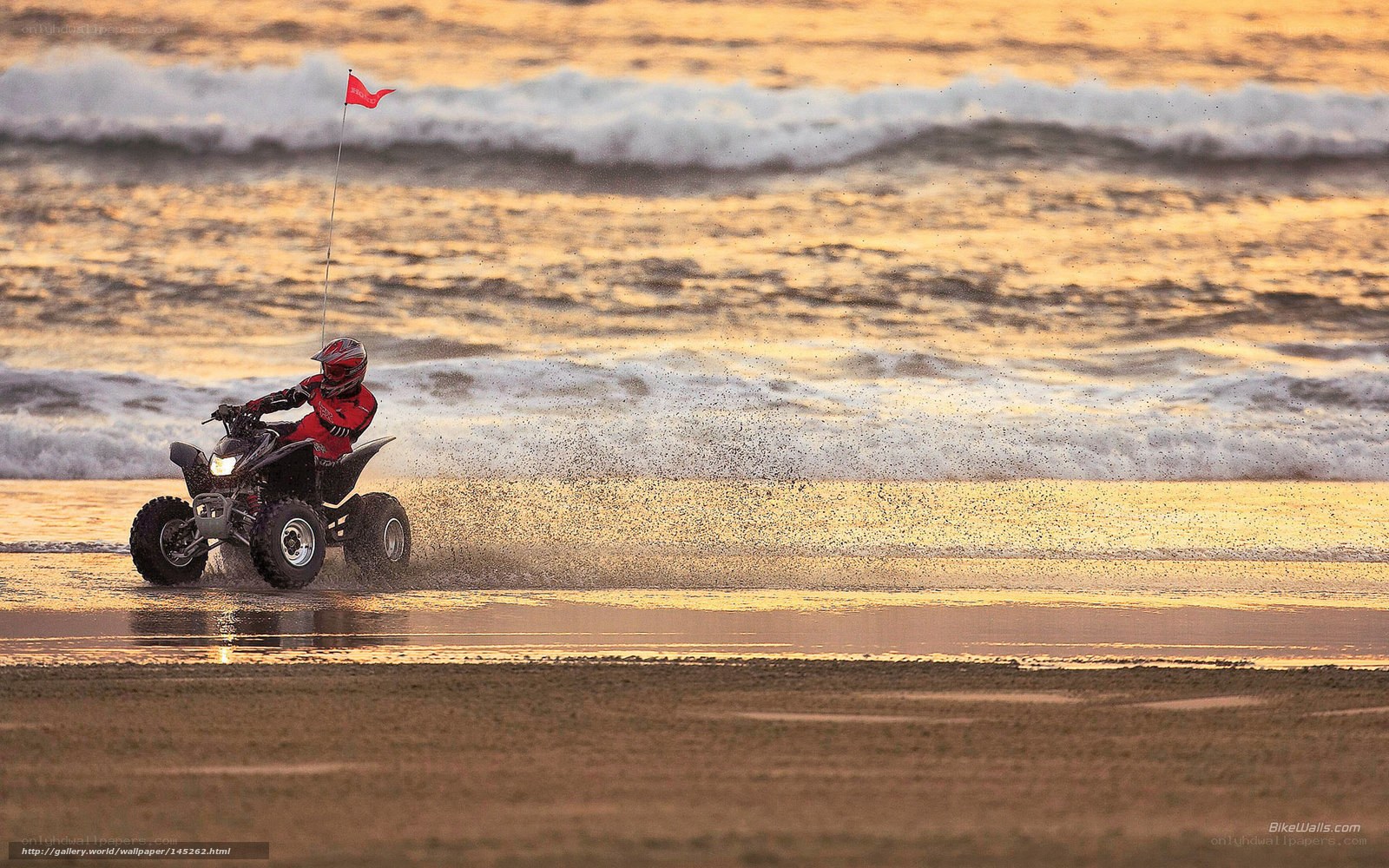 ATV on the beach at sunset