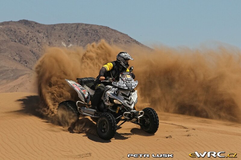 ATV racer on a sand dune