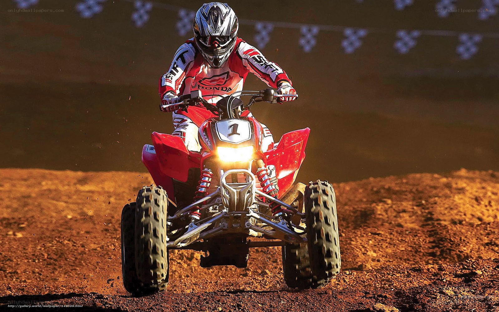 ATV racer on dirt track