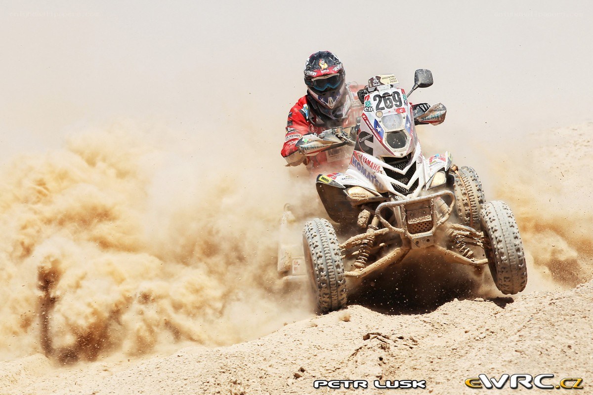 ATV racer on dusty track