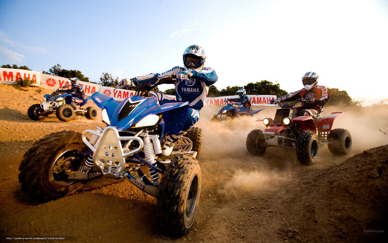 ATV racers on a dirt track
