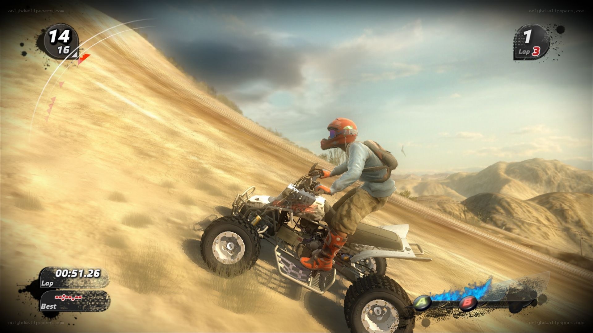 ATV racing on a desert hill