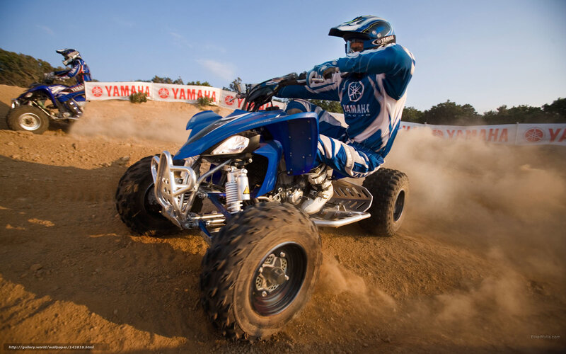 ATV racing on dirt track