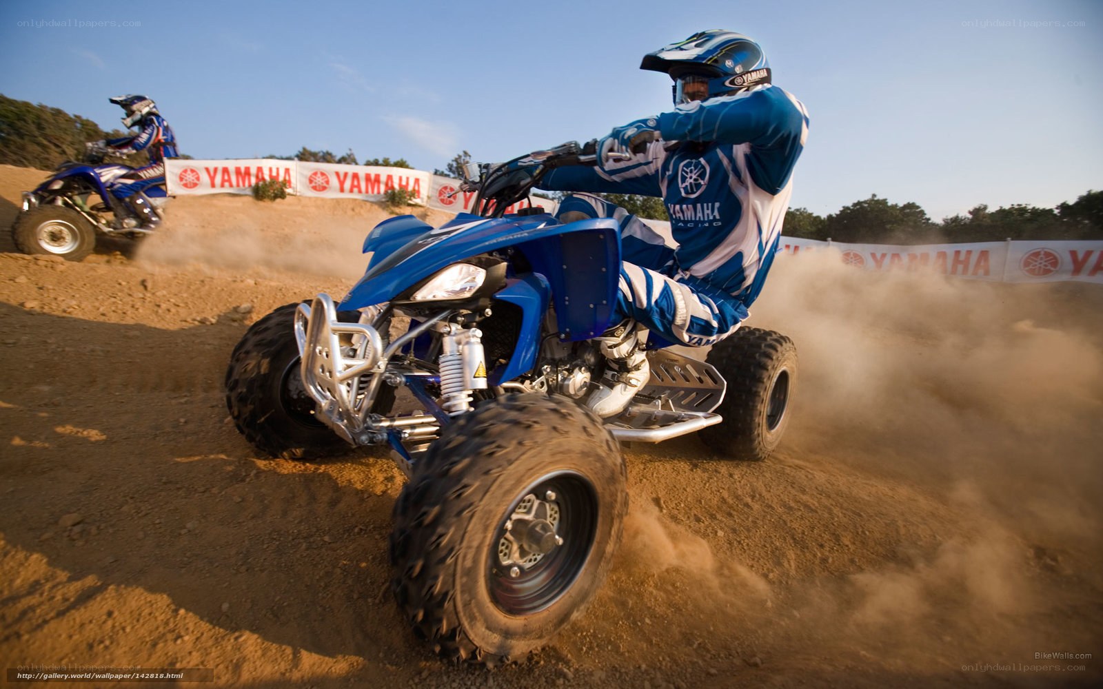 ATV racing on dirt track
