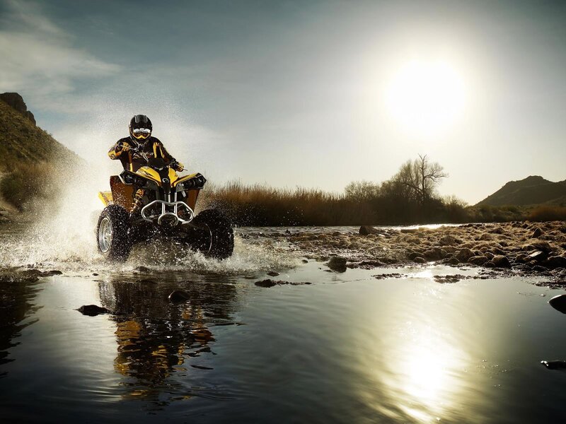 ATV rider crossing river