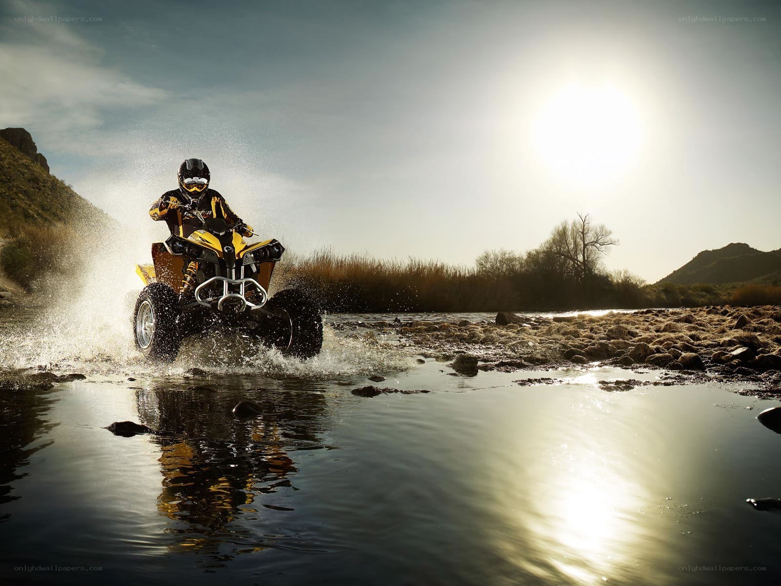 ATV rider crossing river
