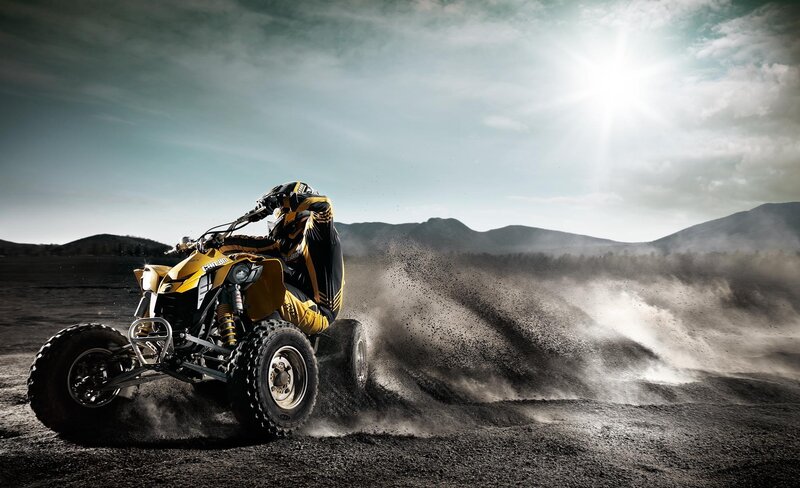 ATV rider in dusty landscape