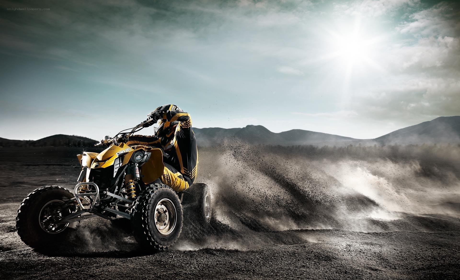 ATV rider in dusty landscape