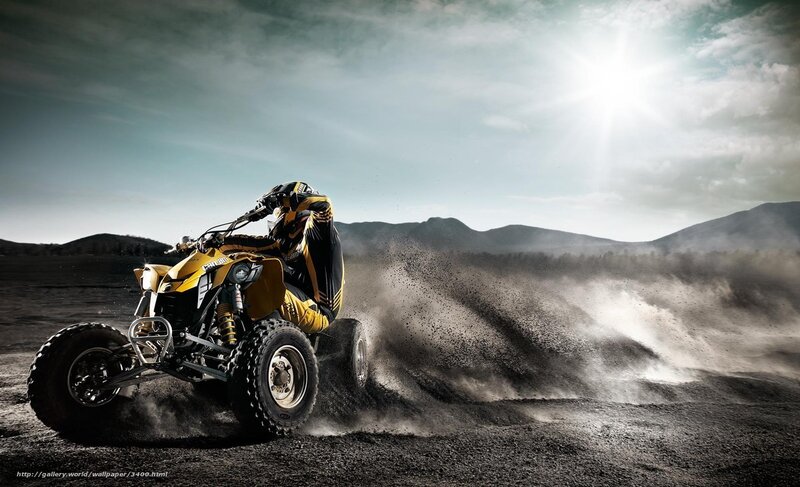 ATV rider in dusty landscape