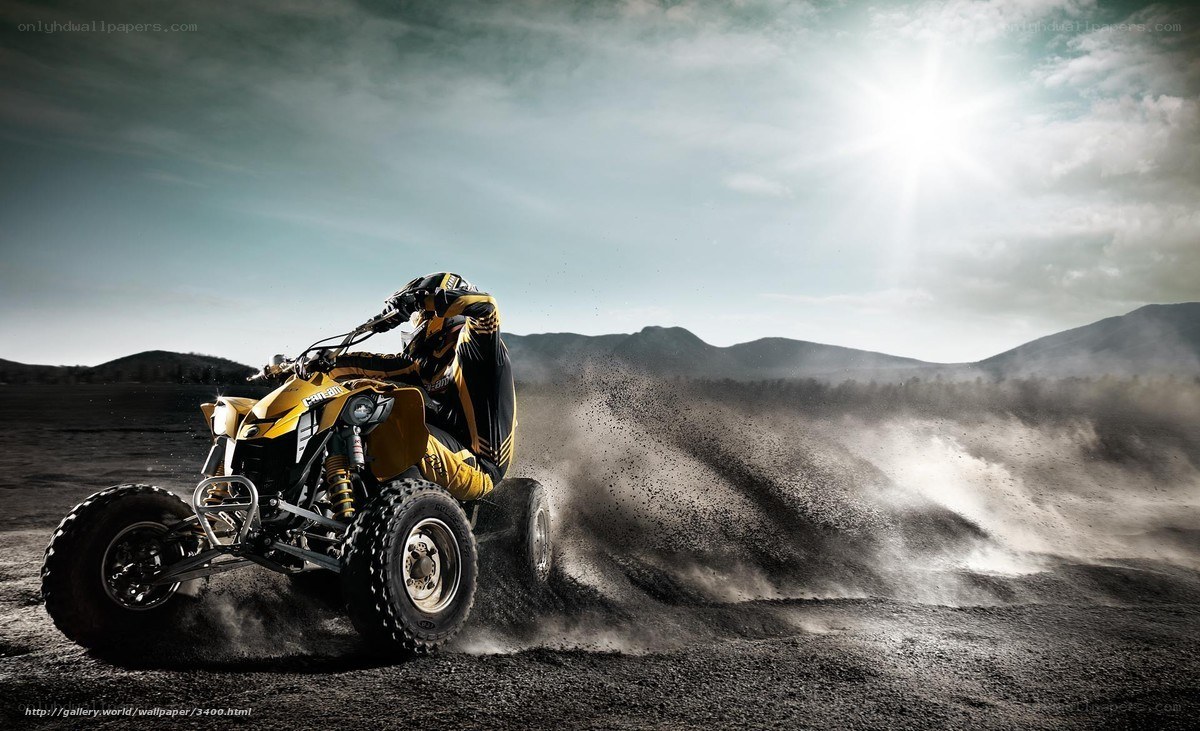 ATV rider in dusty landscape