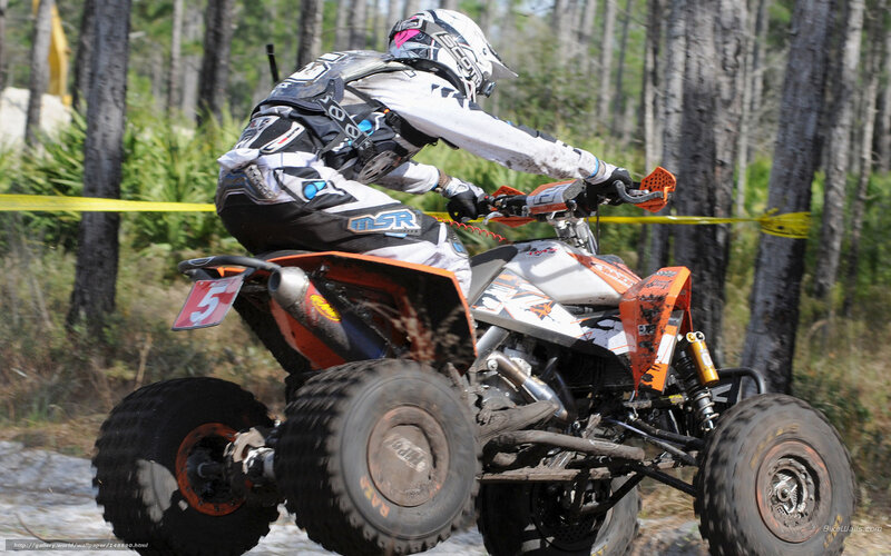 ATV rider in forest race