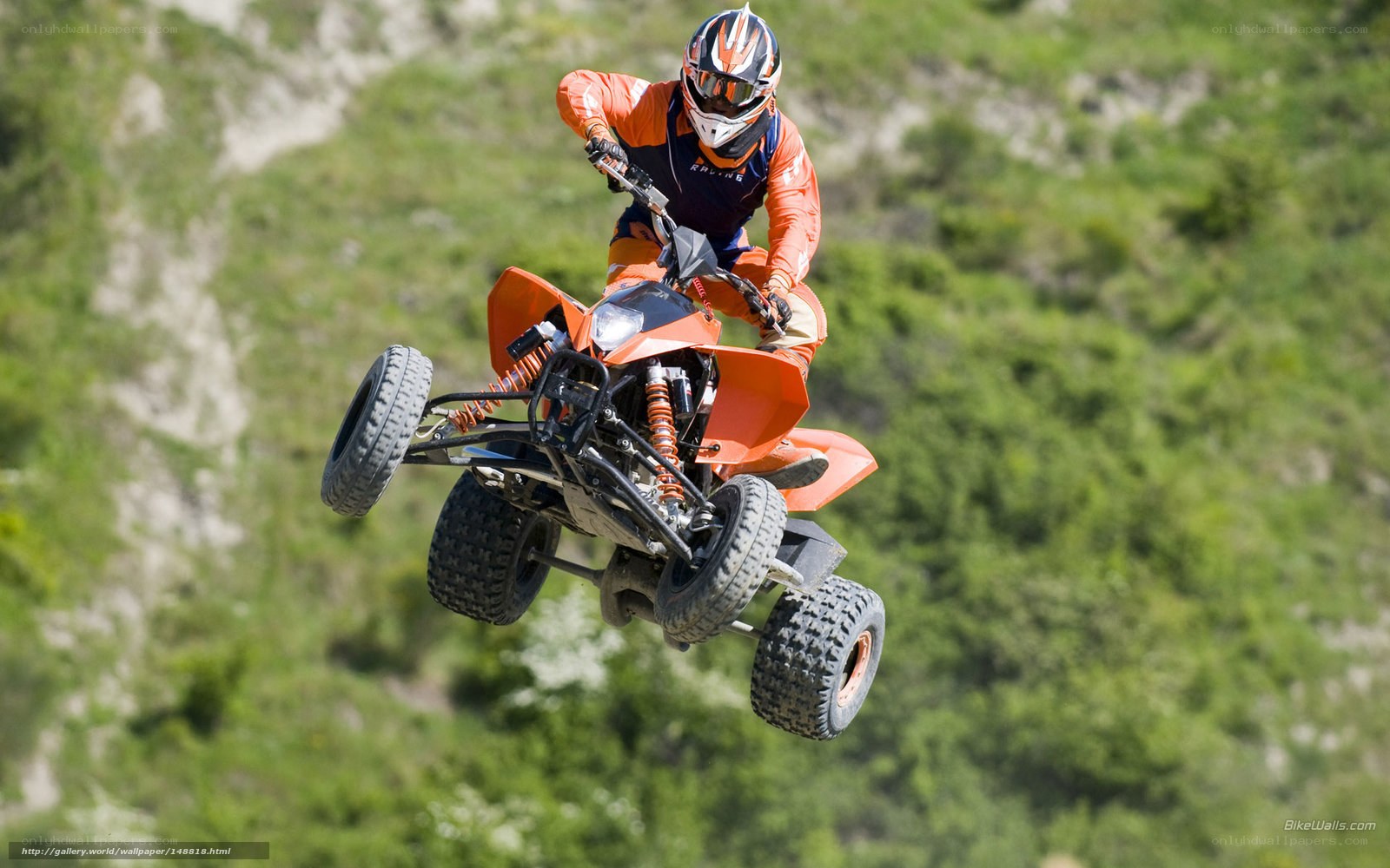 ATV rider in mid-air jump