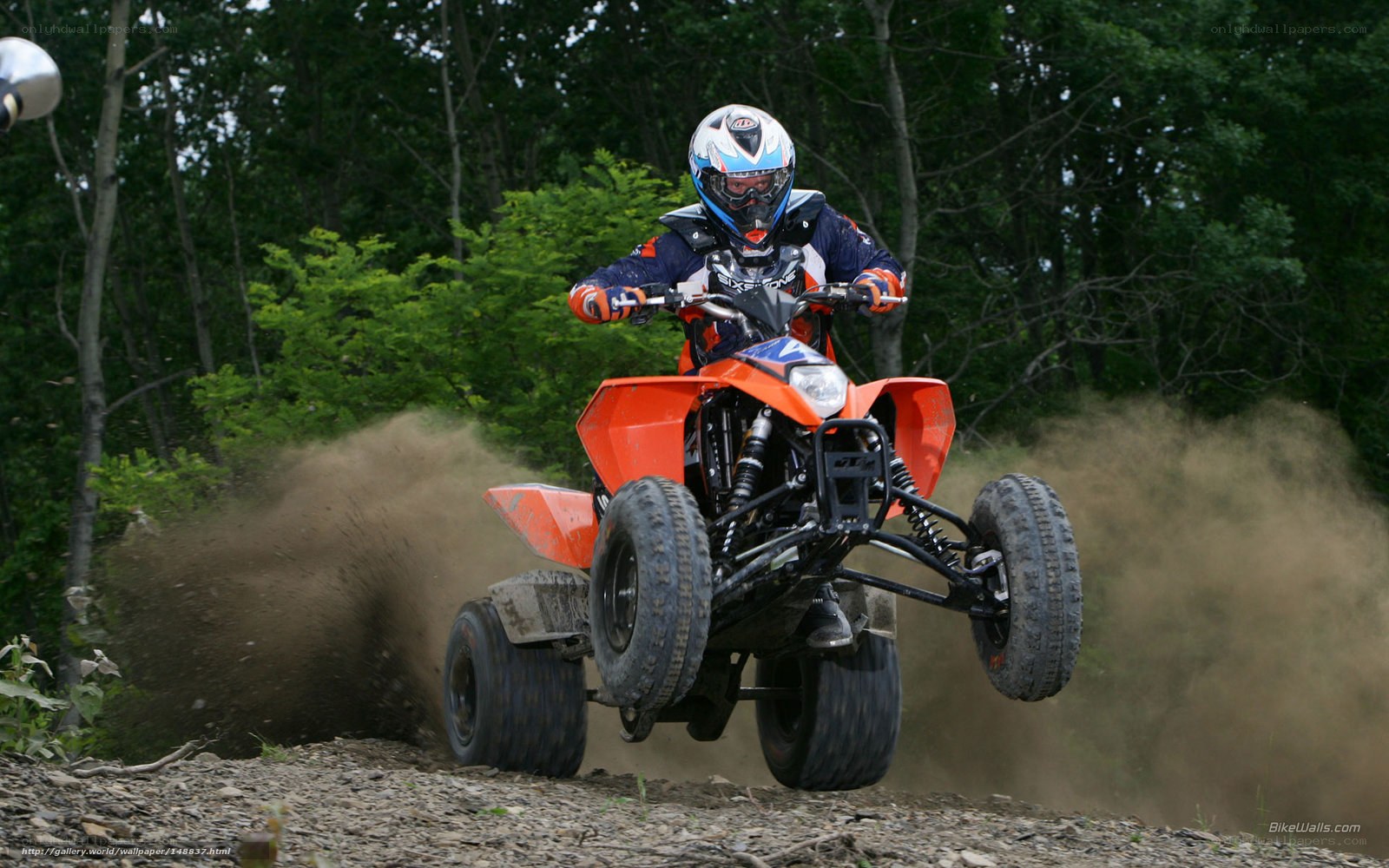 ATV rider in mid-air jump
