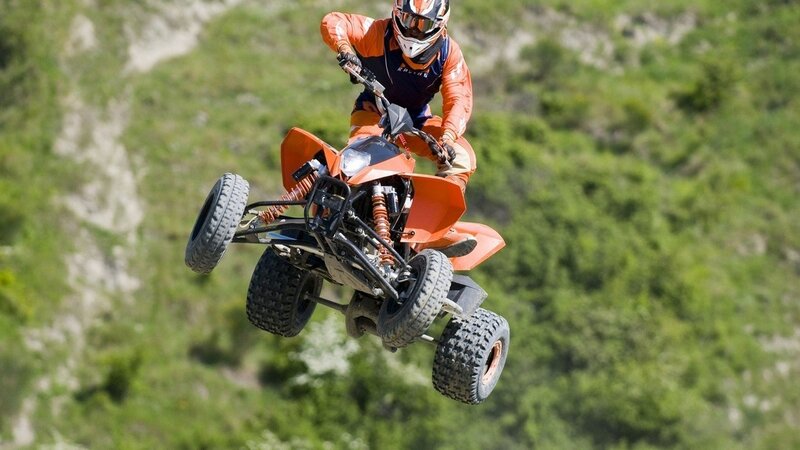 ATV rider in mid-air jump
