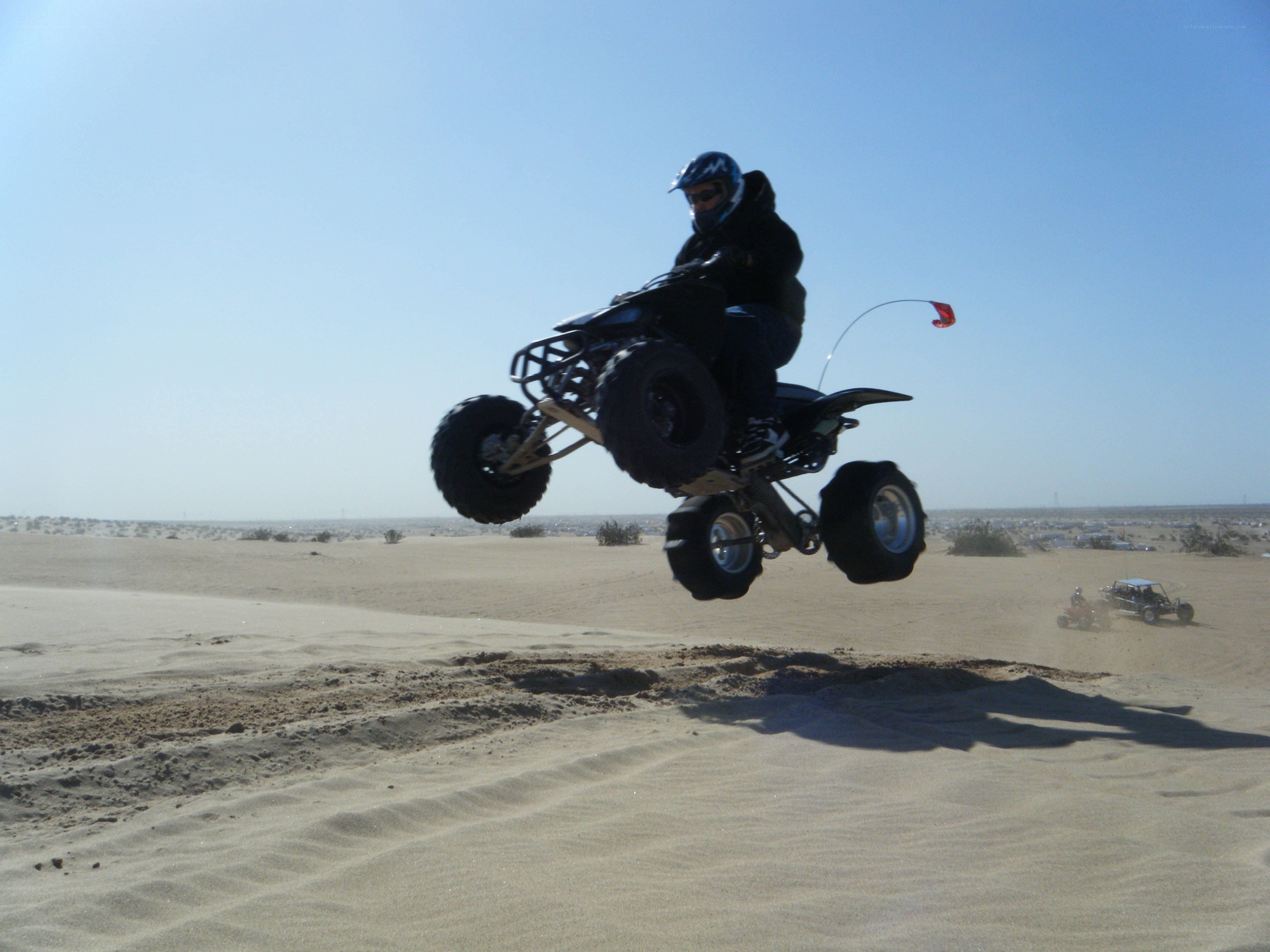 ATV rider jumping in desert