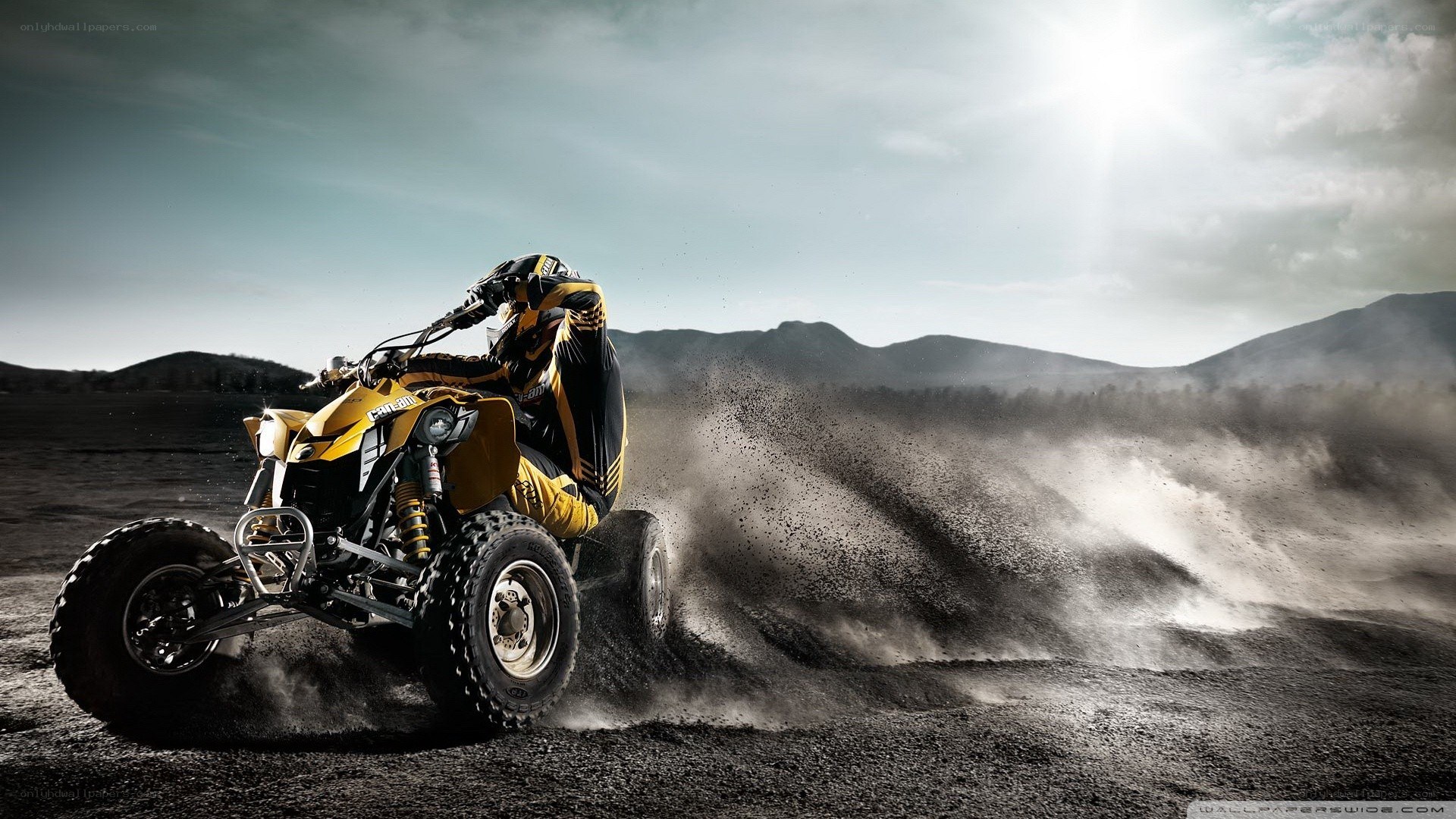 ATV rider kicking up dust