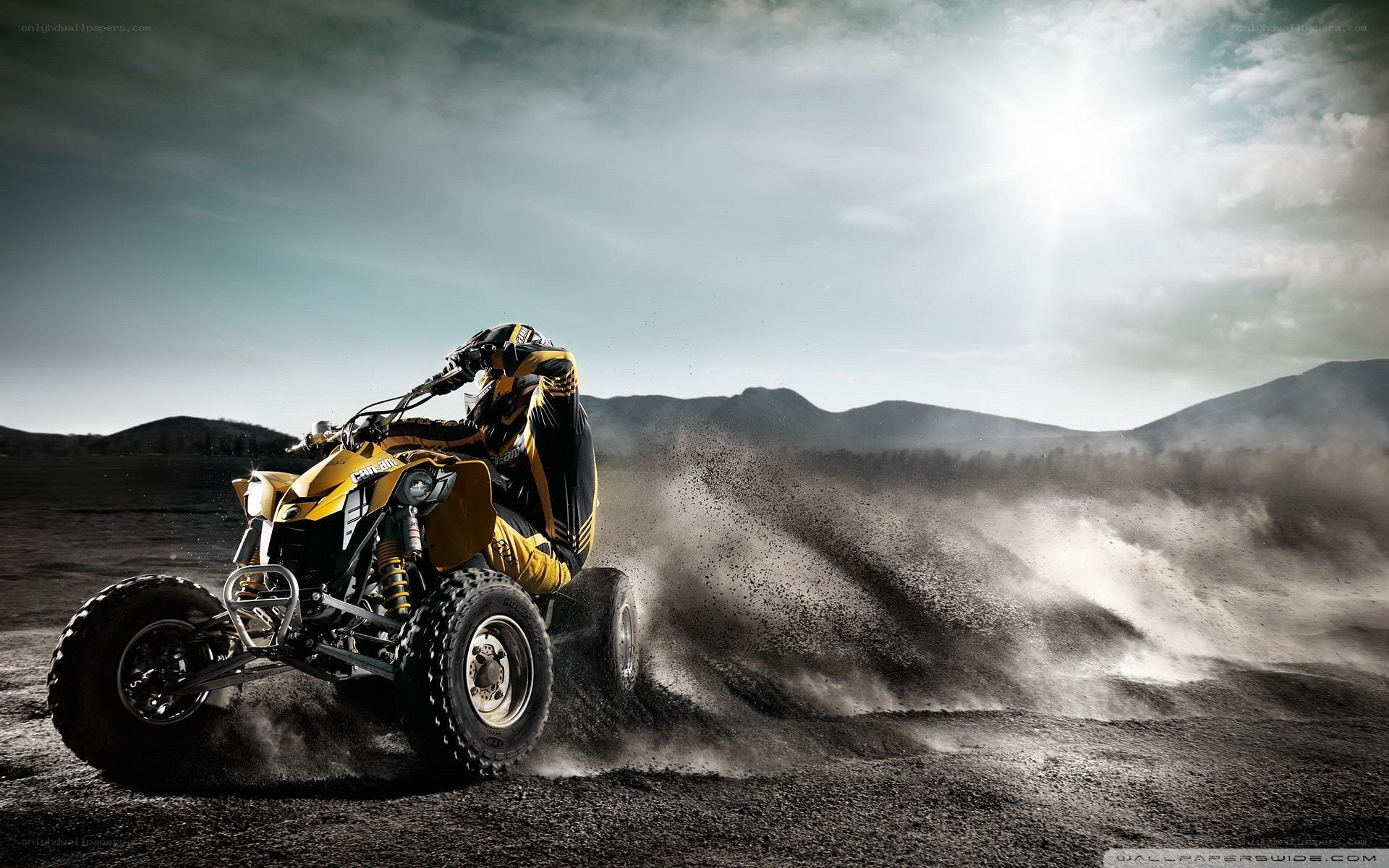 ATV rider kicking up dust
