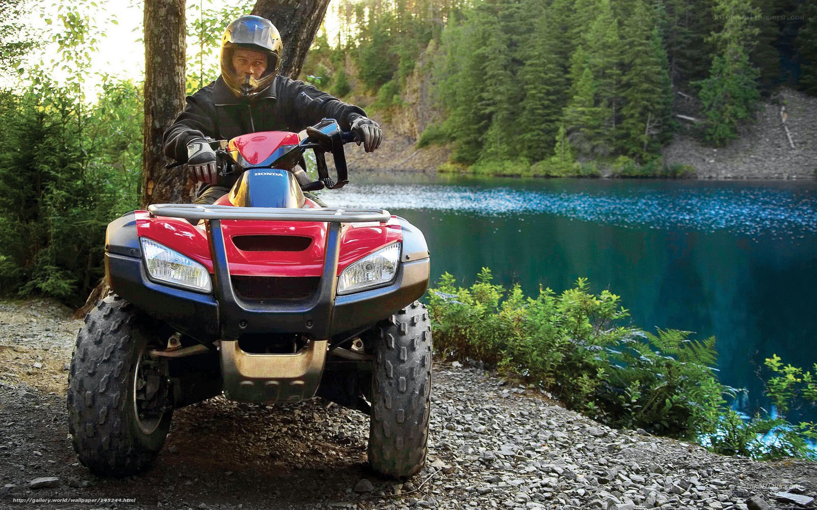 ATV rider near a lake
