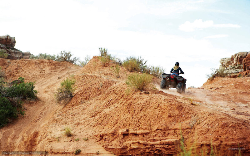 ATV rider on a desert trail