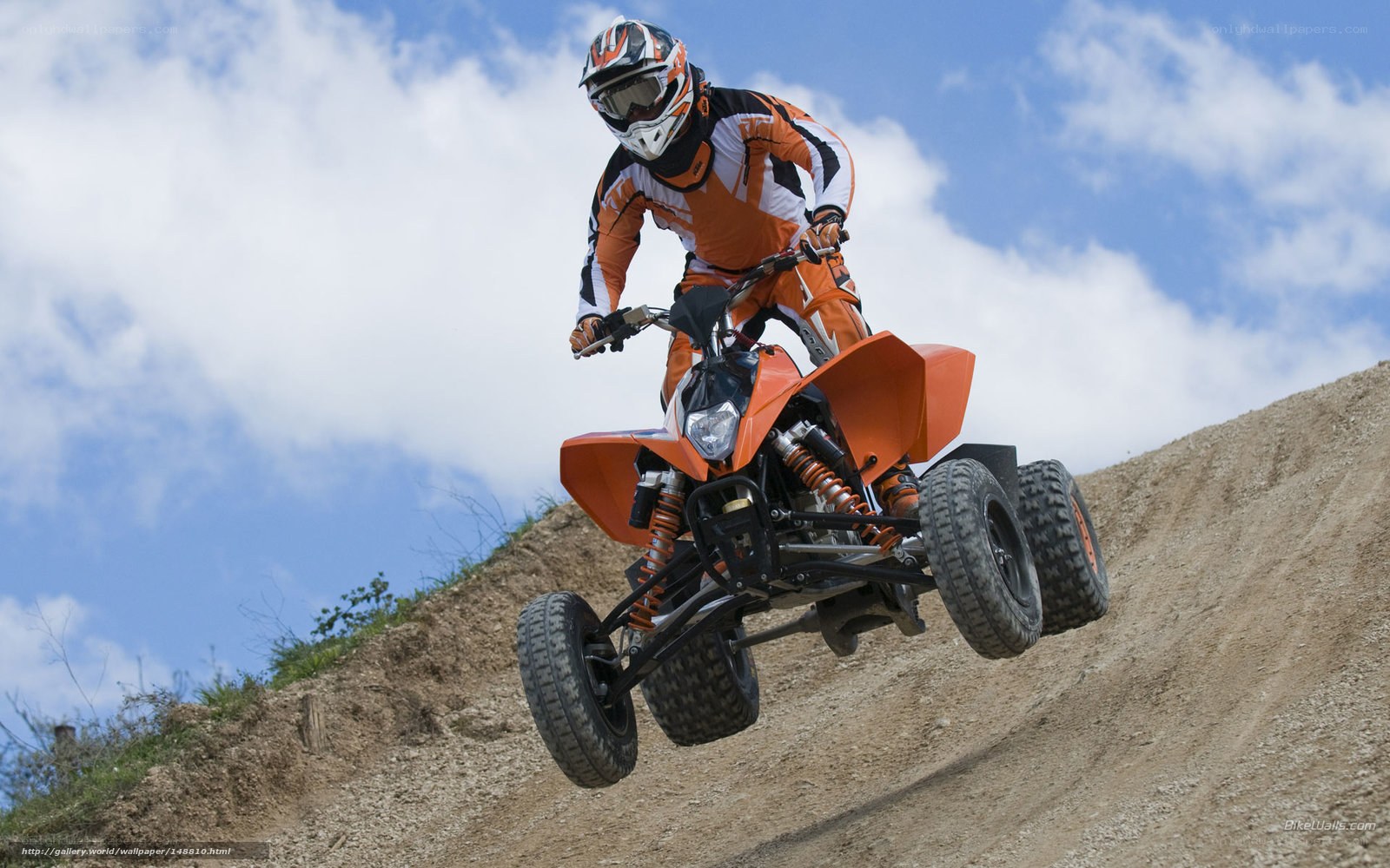 ATV rider on a dirt hill