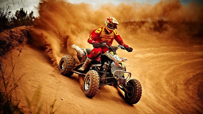 ATV rider on a dusty track