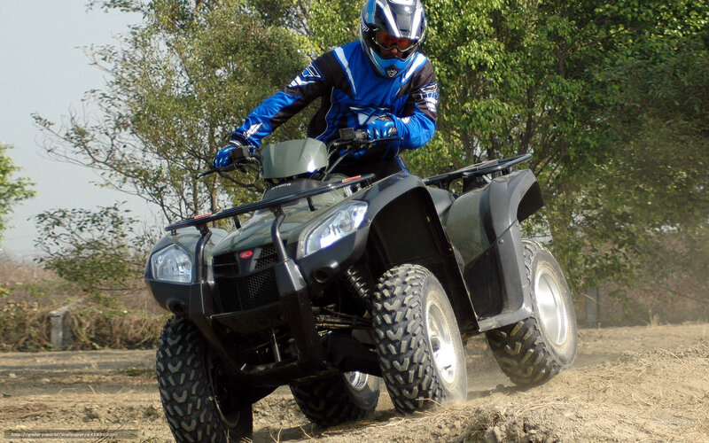 ATV rider on dirt path