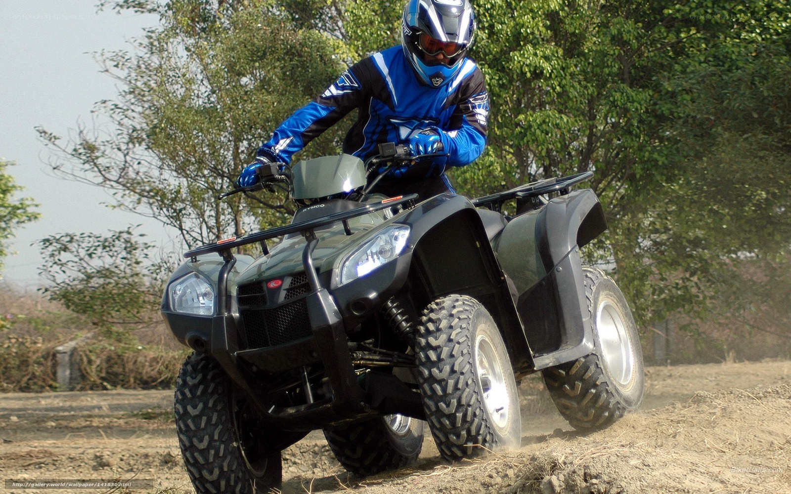 ATV rider on dirt path