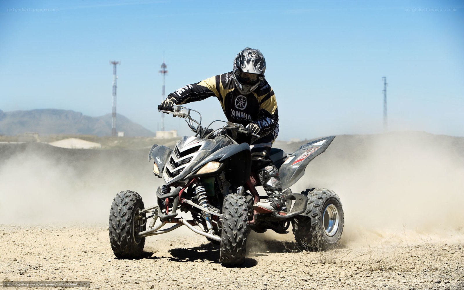 ATV rider on dusty terrain