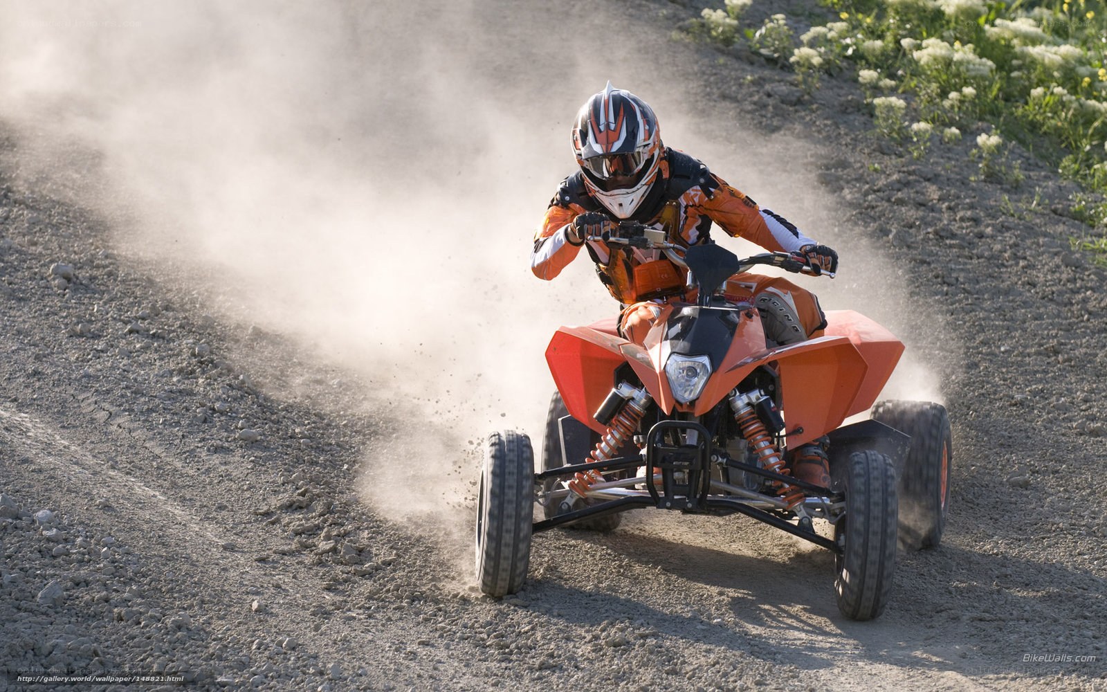 ATV rider on dusty trail