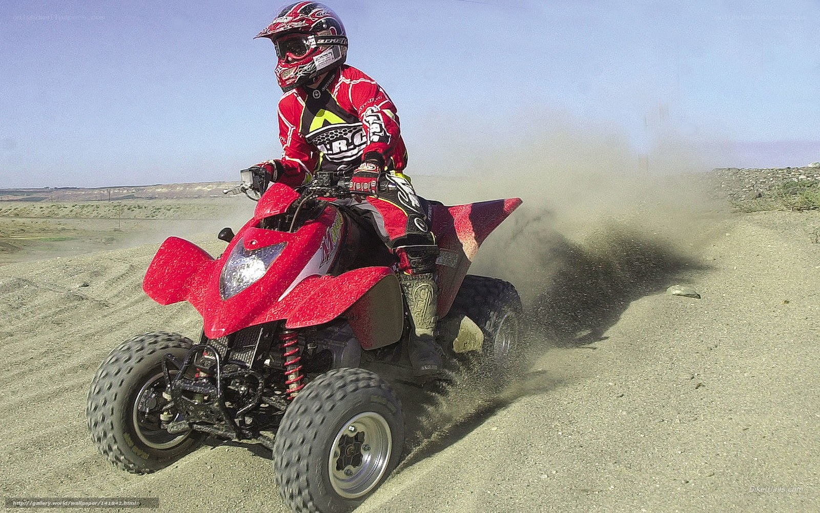 ATV rider on dusty trail