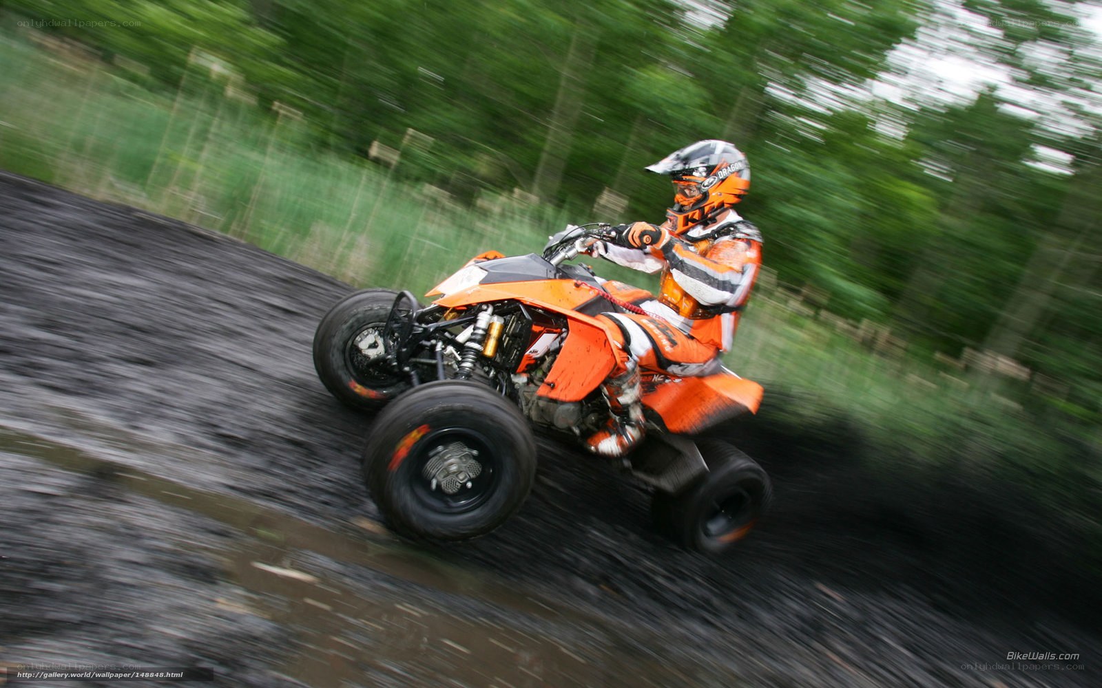 ATV rider on muddy track
